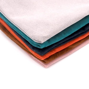 Colorful microfiber velvet drawstring pouches for jewelry storage shown in stacks