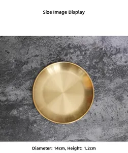 Detail showing a 14cm diameter gold round metal tray with brushed finish texture