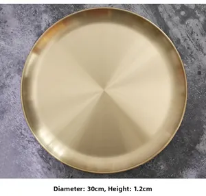 Detail view of 30cm matte gold metal tray with brushed texture and flat 1.2cm rim
