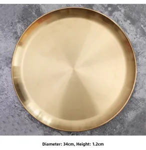 Close-up of 34cm gold metal tray showing brushed finish texture and slim 1.2cm profile