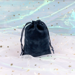 Close-up of black velvet drawstring bag for jewelry storage with soft plush texture