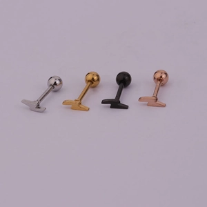 Close-up of lightning bolt steel cartilage studs in silver, gold, black and rose gold