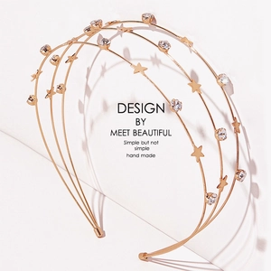 Elegant gold metal headband with sparkling stars and rhinestones for a minimalist look