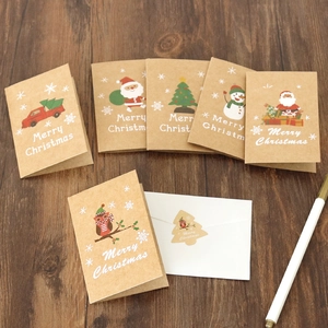 Detail of kraft paper Christmas greeting cards with envelopes and decorative stickers