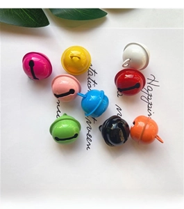 Close-up of colorful 22mm metal jingle bells in multiple candy colors for DIY crafts