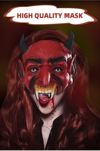 Close-up of a red Halloween demon mask with black horns and realistic latex texture
