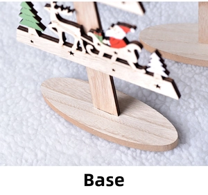 Detail of the oval wooden base and star cutout structure of this Christmas tree ornament