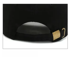 Close-up of black cotton baseball cap with adjustable antique bronze metal buckle