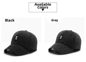 Detail of wool blend outdoor golf baseball caps in black and grey with woven sport labels