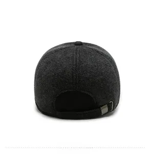 Detail of adjustable metal buckle and thick wool texture on the back of a grey baseball cap