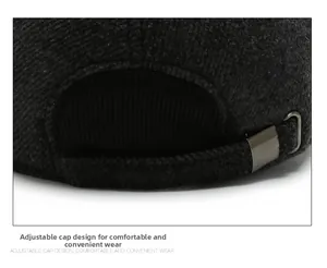 Close-up of the adjustable metal buckle strap on a gray wool blend baseball cap