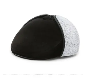 Detail view of winter flat cap featuring warm black plush and grey faux shearling lining