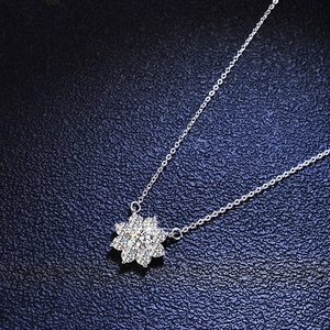 Macro shot of 925 sterling silver sunflower pendant necklace with moissanite stones