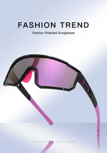 Detail of polarized cycling sunglasses with colorful pink lens and blue splatter frame