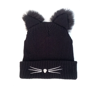 Black knit beanie with cute cat ears and faux fur trim featuring whisker embroidery