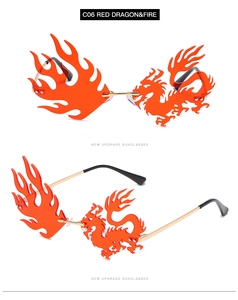 Detail of red frameless dragon and fire shaped sunglasses with sleek gold metal temples
