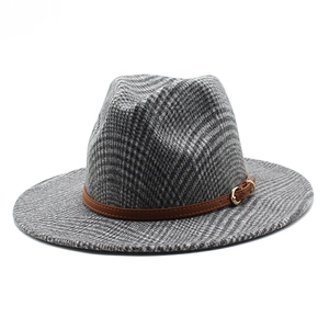 Vintage wool blend fedora hat featuring a black and white plaid pattern and leather band