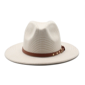 Detail of plaid wool fedora hat with brown leather band and gold metal rivet accents