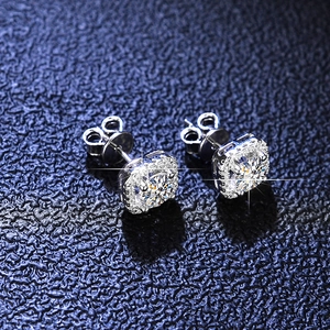 Macro shot of S925 sterling silver moissanite stud earrings with square halo design