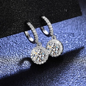 Detail of luxury round moissanite earrings in S925 silver with sparkling halo stones