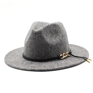 Detail of wool fedora featuring a mixed-color twill texture and decorative metal chains