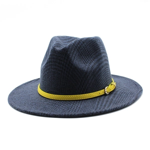 Detail of navy blue wool fedora hat with textured weave and yellow leather buckle strap