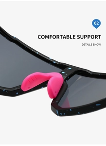 Detail of pink rubber nose bridge on black sports sunglasses with blue pattern