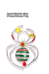 Detailed view of silver spider brooch with rhinestones measuring 51mm by 39mm