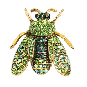 Gold bee brooch with sparkling green crystals and pearls on minimalist white background
