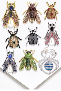 Collection of alloy insect brooches featuring crystals and pearls in various colors