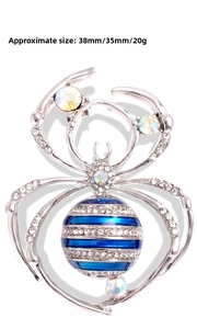 Detailed size chart of the silver crystal spider brooch measuring 38mm by 35mm