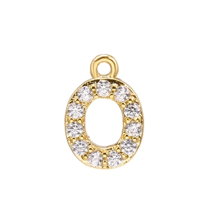 Macro shot of gold-plated oval pendant with white cubic zirconia and top hanging ring