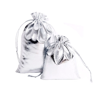 Dual silver metallic drawstring gift bags with woven foil texture for jewelry packaging
