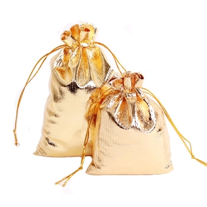 Elegant gold drawstring gift bags made of shiny metallic foil fabric in two sizes
