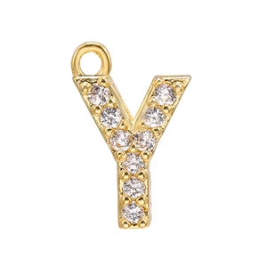 Detailed macro view of gold letter Y pendant with micro-paved white cubic zirconia