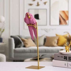 Nordic creative resin parrot figurines with pink feathers and gold accents on a metal stand