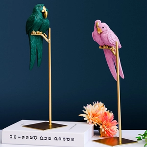 Nordic resin parrot sculptures in green and pink on gold metal stands for home decor