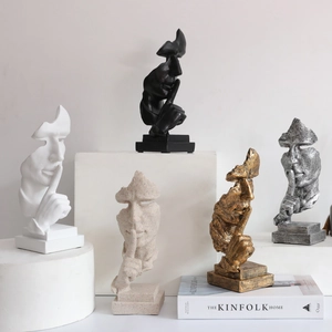 Sculptures abstraites Le Silence est d'Or en résine, finitions noir, blanc, or et argent