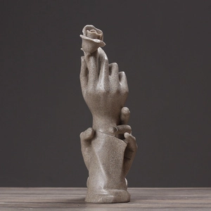 Artistic resin sculpture of holding hands with a rose for romantic home decor