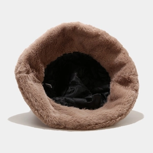 Brown faux fur bucket hat with warm black quilted lining for winter fashion style
