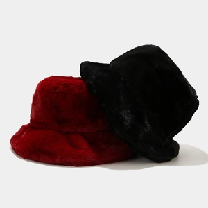 Detailed texture of thick red and black faux fur winter bucket hats for women