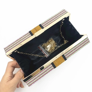 Sparkling dollar theme rhinestone clutch bag with colorful stripes and gold chain strap