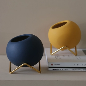 Modern Morandi ceramic vase set with blue and yellow matte finish on gold metal stands