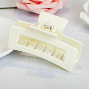 Minimalist cream white rectangular hollow hair claw clip with matte finish for women