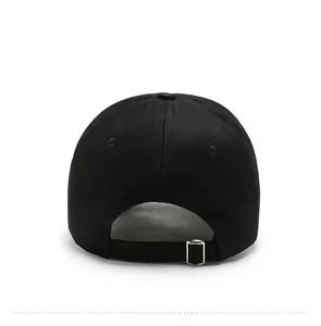 Rear view of black cotton baseball cap showing adjustable silver metal buckle and six panels