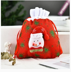 Detail of red Christmas drawstring gift bag with a 3D snowman and green snowflake prints