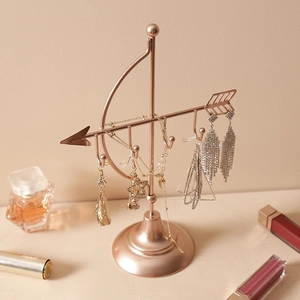Elegant rose gold Cupid arrow jewelry stand for organizing necklaces and earrings
