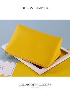 Primer plano del neceser amarillo de cuero sintético granulado con cremallera de metal plateado