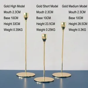 Set of 3 Nordic gold metal pillar candle holders in various heights for table decor