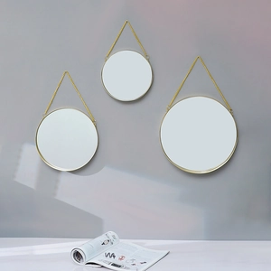Set of three Nordic golden round wall mirrors with hanging chains for home decor